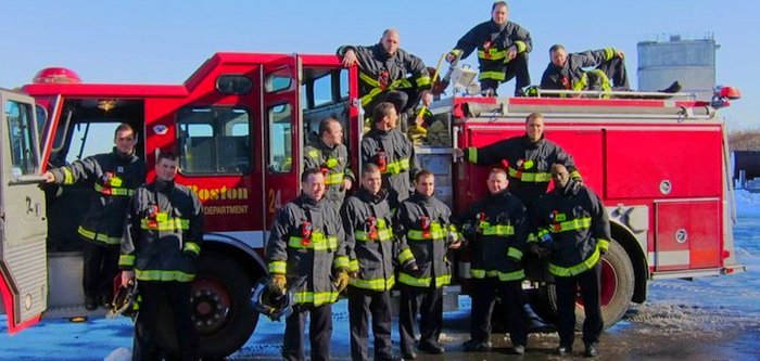 firemen in front of truck