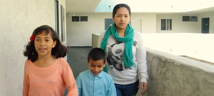 A young family practices their family escape plan